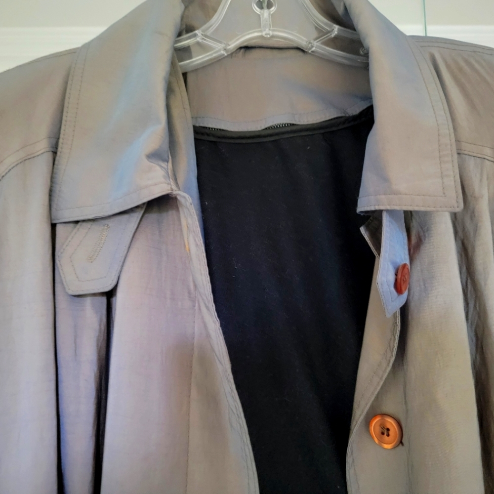 Glamorous long vintage coat has pleated back. Belt. Padded shoulders. Lining